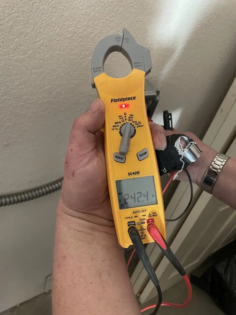 Voltage testing with clamp meter during Ceiling Fan Installation in Richfield
